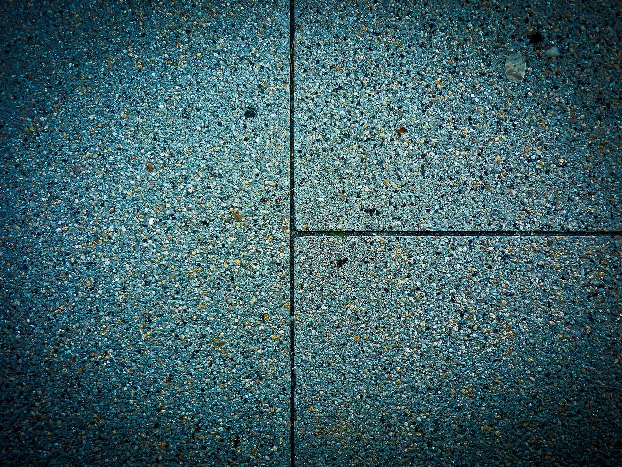 Rows of stone slabs standing in a slab yard.
